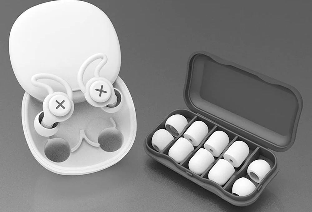 White dual-layer silicone sleep earplugs in their case, with spare foam tips